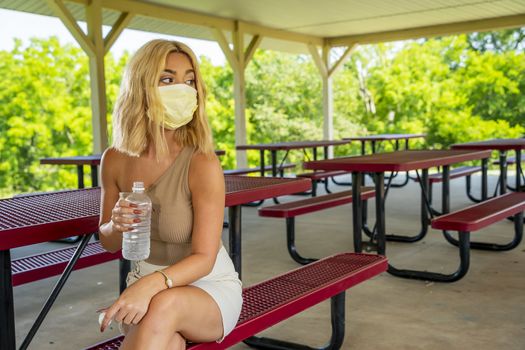A gorgeous young blonde model enjoys a day outdoors while maintaining a safe distance from others during the Covid-19 pandemic
