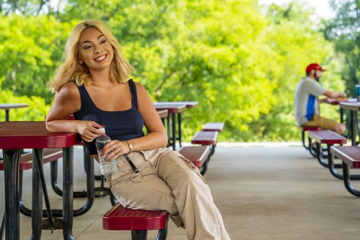 A gorgeous young blonde model enjoys a day outdoors while maintaining a safe distance from others during the Covid-19 pandemic