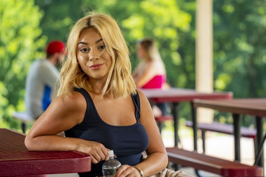 A gorgeous young blonde model enjoys a day outdoors while maintaining a safe distance from others during the Covid-19 pandemic
