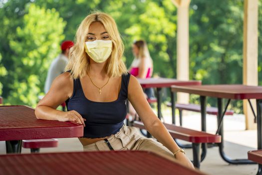 A gorgeous young blonde model enjoys a day outdoors while maintaining a safe distance from others during the Covid-19 pandemic