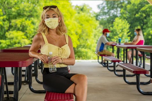 A gorgeous young blonde model enjoys a day outdoors while maintaining a safe distance from others during the Covid-19 pandemic