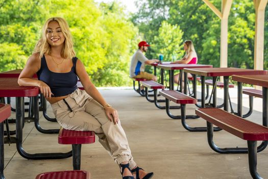 A gorgeous young blonde model enjoys a day outdoors while maintaining a safe distance from others during the Covid-19 pandemic