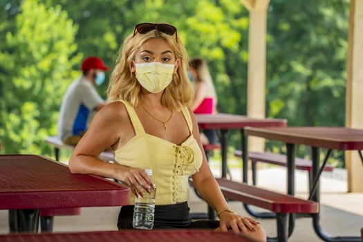 A gorgeous young blonde model enjoys a day outdoors while maintaining a safe distance from others during the Covid-19 pandemic