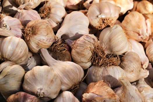 Garlic for sale at a market stall background