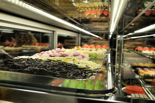 Colorful cakes and sweets in a pastry shop in Spain