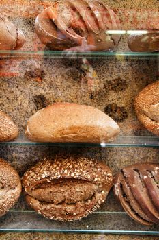 Loaves of bread in a bakery showcase