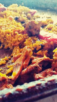 Rice paella with rabbit. Typical Spanish dish.