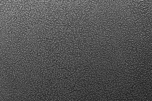 Texture and full frame background of hammered powder paint coating on flat sheet steel surface. Also known as hammertone effect.
