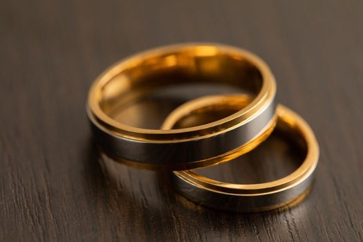 Gold wedding rings designed for newlyweds during the ceremonial marriage ceremony.