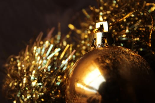 Beautiful golden Christmas tree balls and garlands