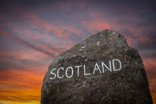 A Stone Marking The Border Between England And Scotland During A Beautiful Sunset
