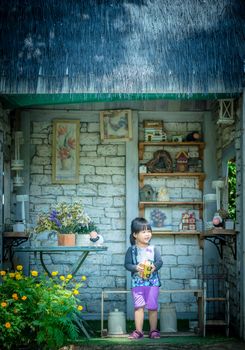 little girl standing in vintage house background