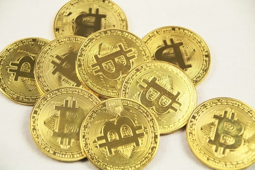 Many Golden bitcoins on white background