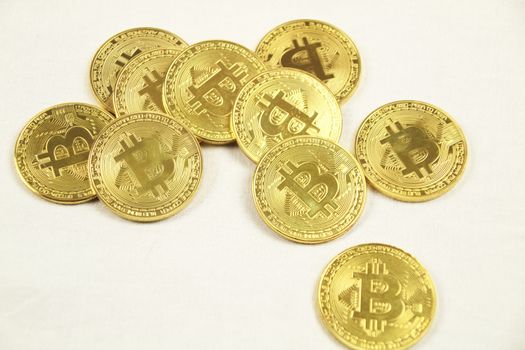 Many Golden bitcoins on white background