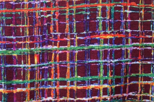 Detailed close up view on samples of cloth and fabrics in different colors found at a fabrics market.