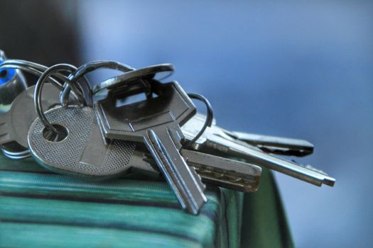 Bunch of keys on the table with green tablecloth