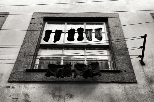 Men underwear hanging on a clothesline in Portugal. Monochrome picture.