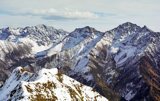 Mount Sayan in winter in the snow. The nature of the mountains is sayan.