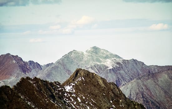 Mount Sayan in winter in the snow. The nature of the mountains is sayan.