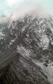 Mount Sayan in winter in the snow. The nature of the mountains is sayan.