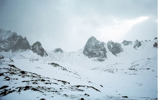 Mount Sayan in winter in the snow. The nature of the mountains is sayan.
