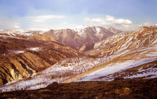 Mount Sayan in winter in the snow. The nature of the mountains is sayan.
