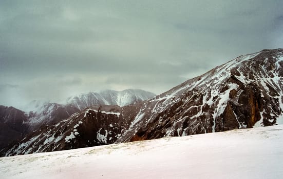 Mount Sayan in winter in the snow. The nature of the mountains is sayan.