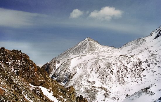 Mount Sayan in winter in the snow. The nature of the mountains is sayan.