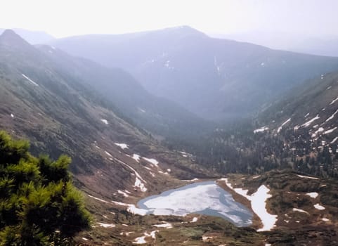 Mount Sayan in winter in the snow. The nature of the mountains is sayan.