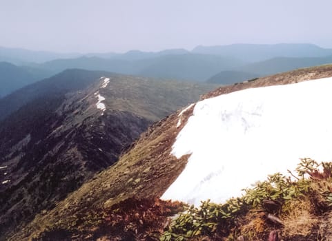 Mount Sayan in winter in the snow. The nature of the mountains is sayan.