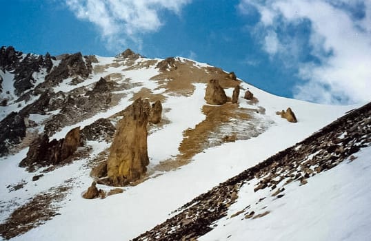 Mount Sayan in winter in the snow. The nature of the mountains is sayan.