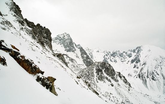 Mount Sayan in winter in the snow. The nature of the mountains is sayan.