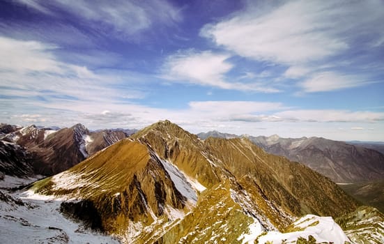 Mount Sayan in winter in the snow. The nature of the mountains is sayan.