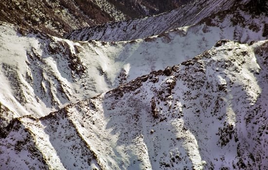 Mount Sayan in winter in the snow. The nature of the mountains is sayan.