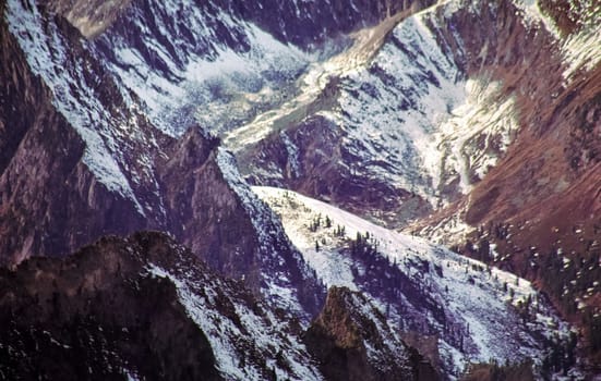 Mount Sayan in winter in the snow. The nature of the mountains is sayan.