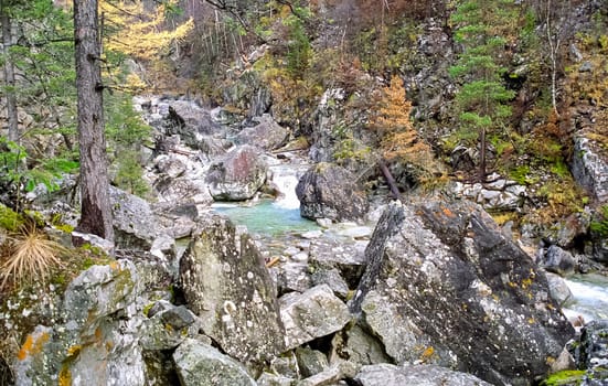 Mountain river. Stones and water of a mountain river. The mountains are said.