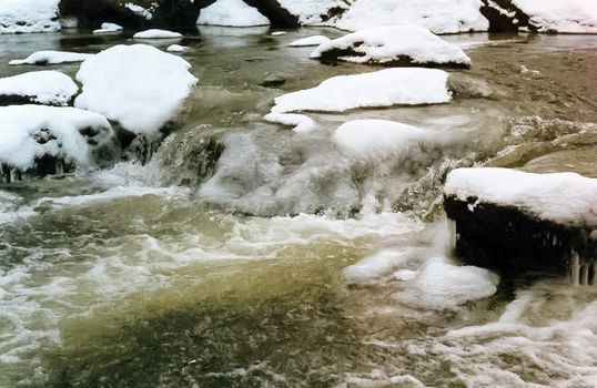 Mountain river. Stones and water of a mountain river. The mountains are said.