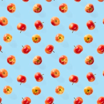 Seamless pattern with ripe apples. Apple seamless pattern on blue background. Tropical fruit abstract background.