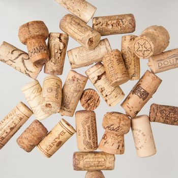 Tashkent, Uzbekistan - March 19, 2008 : Heap of old wine corks on white background. Studio photography