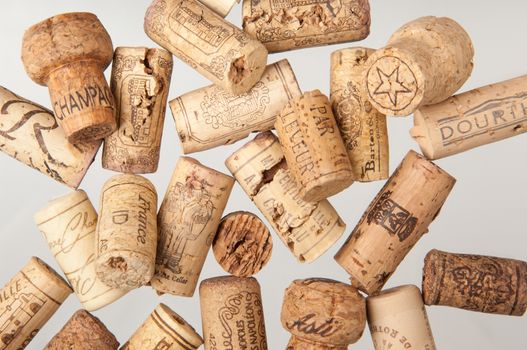 Tashkent, Uzbekistan - March 19, 2008 : Heap of old wine corks on white background. Studio photography