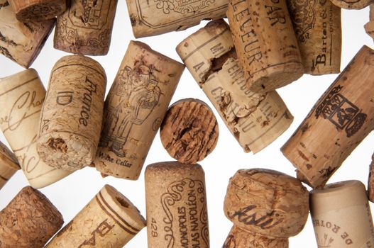 Tashkent, Uzbekistan - March 19, 2008 : Heap of old wine corks on white background. Studio photography