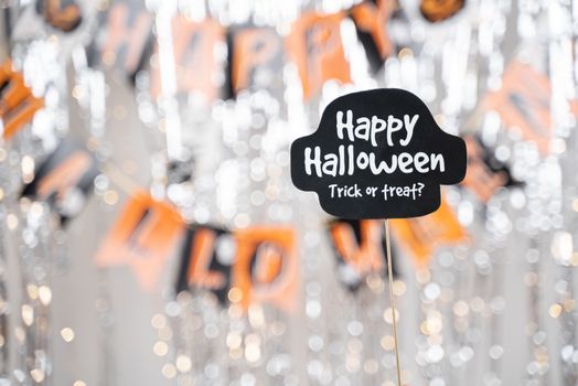 Happy Halloween and trick or treat signage booth prop on decorated background - concept of holiday and halloween festival