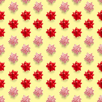 Seamless regular creative Christmas pattern with New Year decorations on yellow background. xmas Modern Seamless pattern made from christmas decorations. Photo quality pattern for fabric, prints, wallpapers, banners or creative design works.