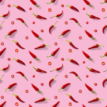 Red hot chilli seamless peppers pattern. Seamless pattern made of red chili or chilli on pink background. Minimal food pattern. Food background.