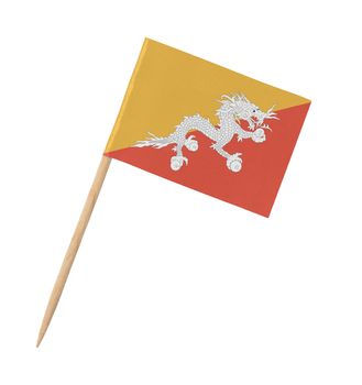 Small paper flag of Bhutan on wooden stick, isolated on white
