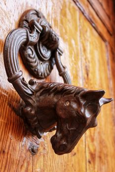 Beautiful and Vintage door knocker horse shaped on wooden door