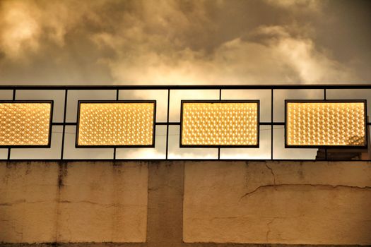 Crystal reflecting golden light at dusk in a building under grey sky