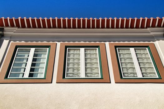 Beautiful and old colorful typical facade next to the water canal in Aveiro village in January