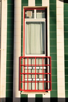 Beautiful and colorful striped facades in Costa Nova beach in Aveiro, Porto, Portugal.