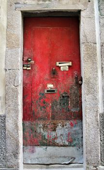 Old and colorful wooden door with iron details in Lisbon, Portugal